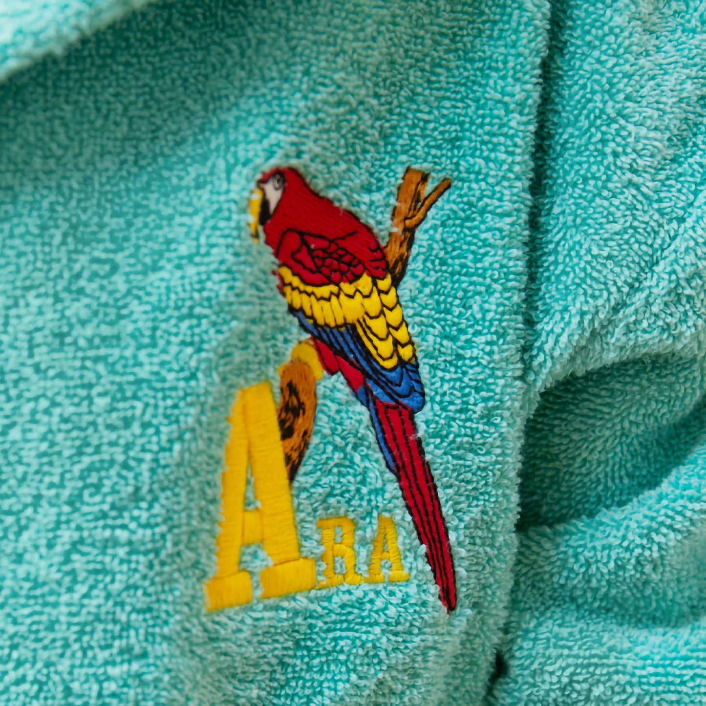 Peignoir brodé à capuche turquoise - Motif Ara